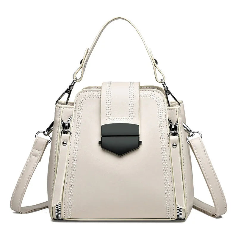 Soft PU leather ladies handbag with textured surface and sewing thread detailing in square vertical shape