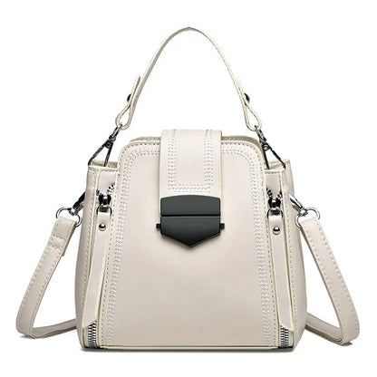 Soft PU leather ladies handbag with textured surface and sewing thread detailing in square vertical shape