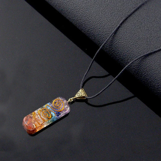 A stylish 7-chakra crystal pendant featuring a unique geometric design and natural stone patterns
