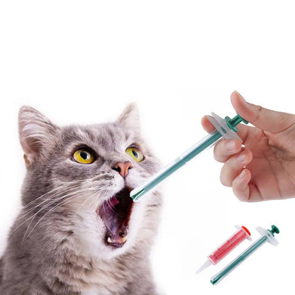 Two silicone pet pill shooters with soft tips for cat and dog medication.