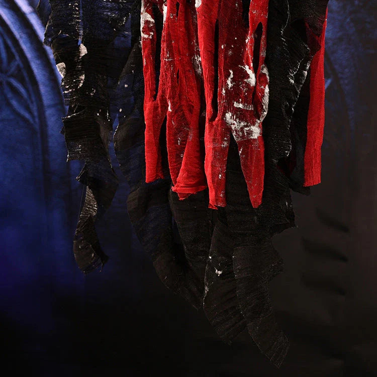 A spooky hanging skeleton ghost decoration with a chilling howl and flashing red eyes