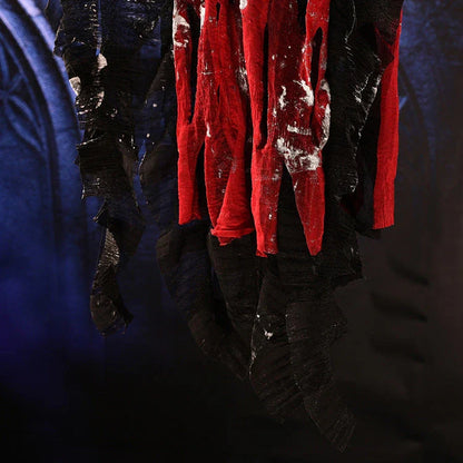 A spooky hanging skeleton ghost decoration with a chilling howl and flashing red eyes