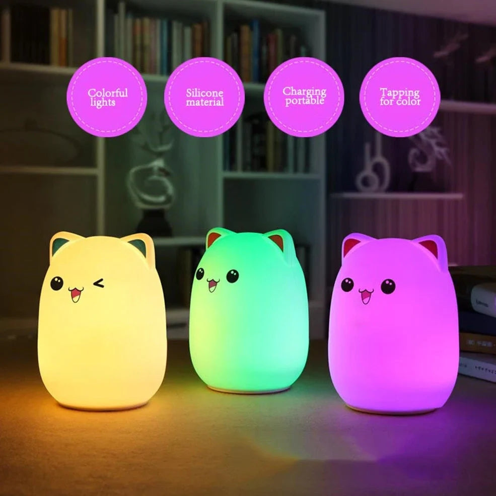 Cartoon silicone night lamp with clap activation in blue or pink, dimensions 100x100x135mm