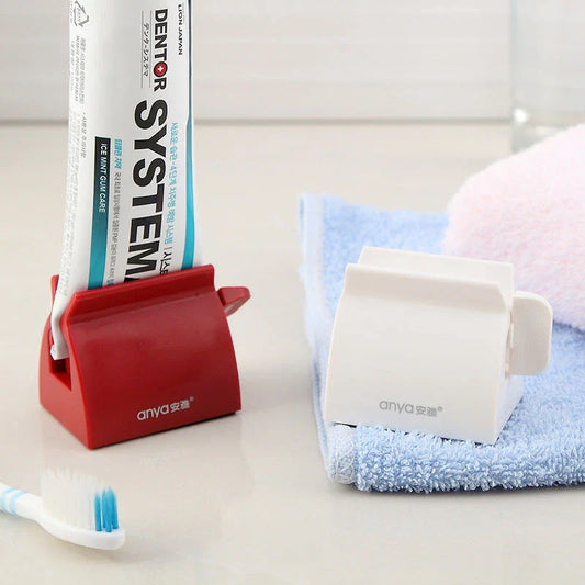 Versatile toothpaste dispenser made of durable ABS plastic for effortless product extrusion and bathroom organization