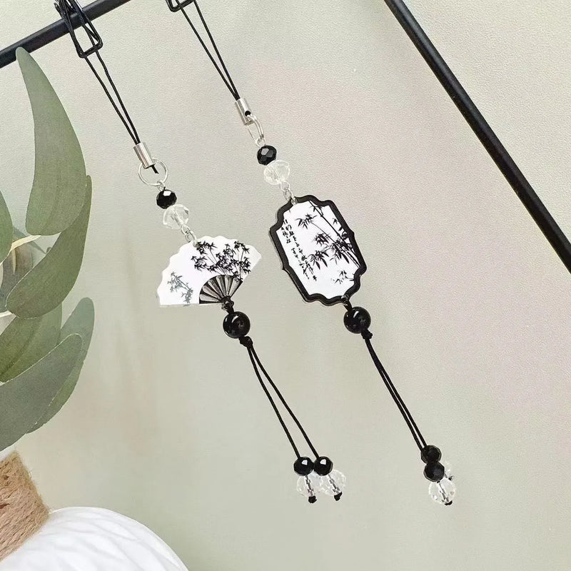 Guofeng Chinese style pendant keychain for schoolbag charm bead crafted with baked varnish treatment featuring detailed plants and flowers pattern available in Fan or Poetry colour designs with secure metal clip attachment