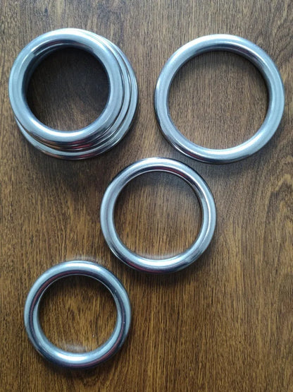 Wing Chun carbon steel training ring showing three adjustable sizes for forearm strengthening exercises