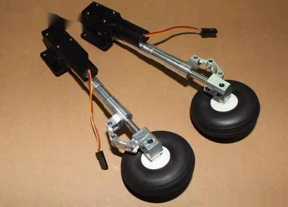 Retractable alloy landing gear for RC plane with shock absorber and large wheel.