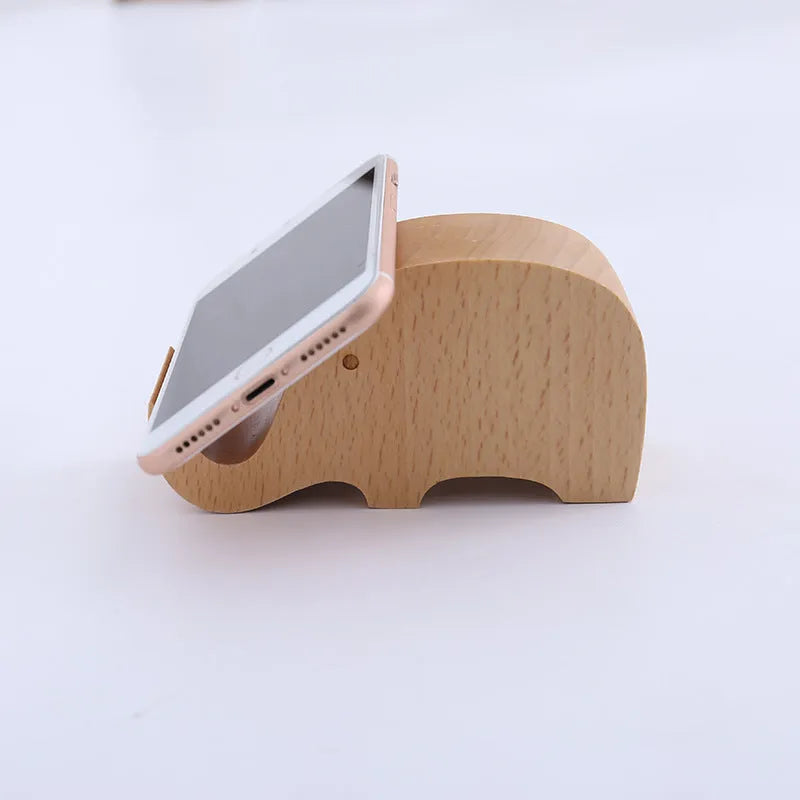 Beech wood mobile phone holder with coin slot showing adjustable angle and resin decorative elements