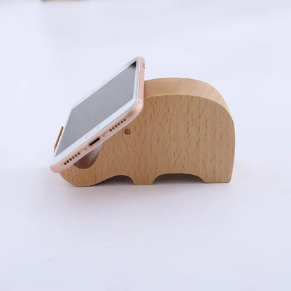 Beech wood mobile phone holder with coin slot showing adjustable angle and resin decorative elements