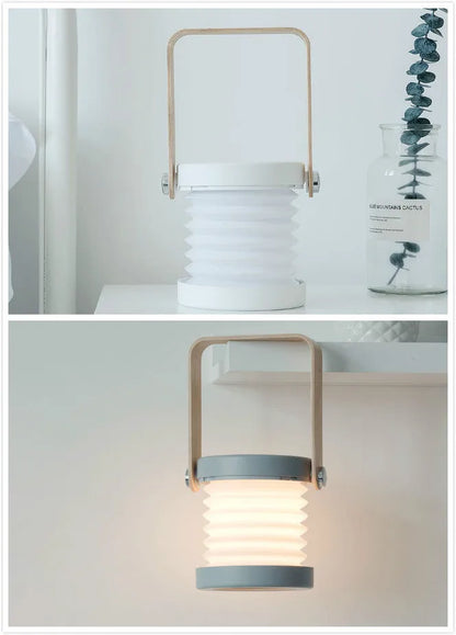White foldable USB rechargeable LED night light in both table lamp and tall lantern modes.