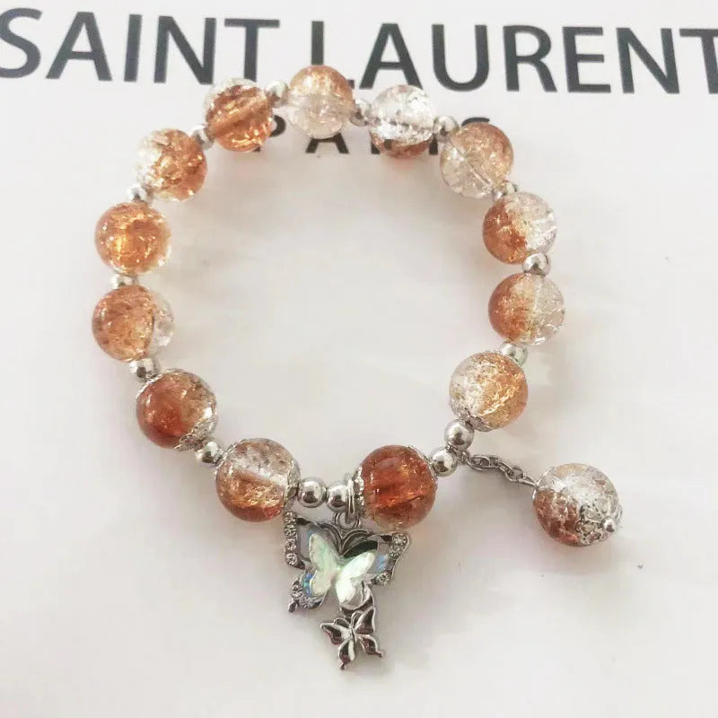 Chinese style glass bead bracelet with bamboo joint design on wrist.