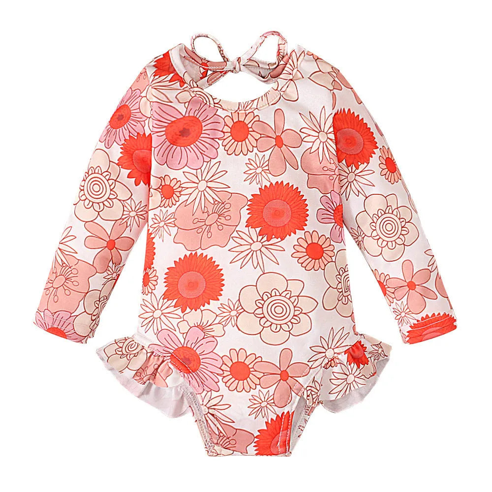 Girl's floral print swimsuit with crew neck and open back design in polyester fabric
