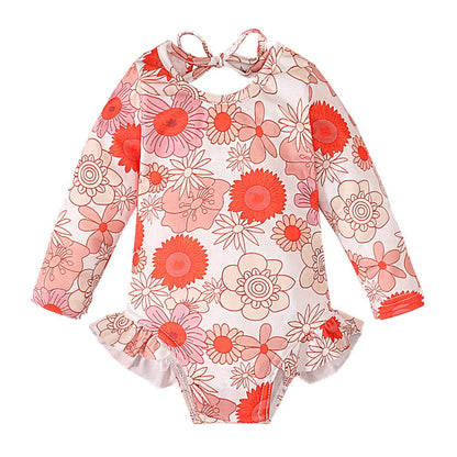 Girl's floral print swimsuit with crew neck and open back design in polyester fabric