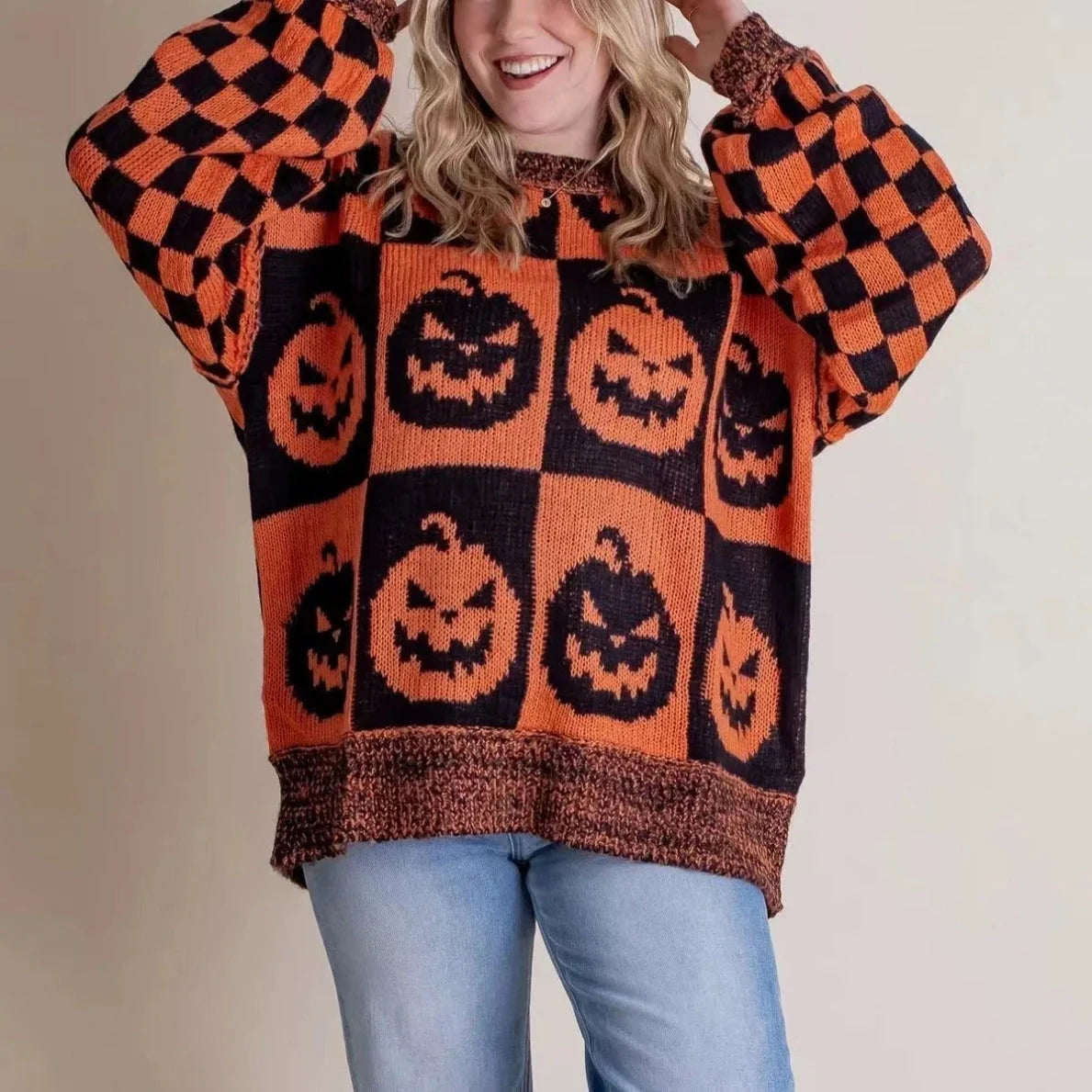 A stylish Halloween sweater featuring a unique pumpkin and ghost graphic design, available in a variety of fashion-forward colors.