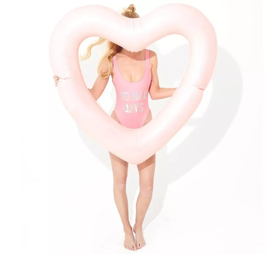 Oversized 120cm heart-shaped swim ring for adults in vibrant colors