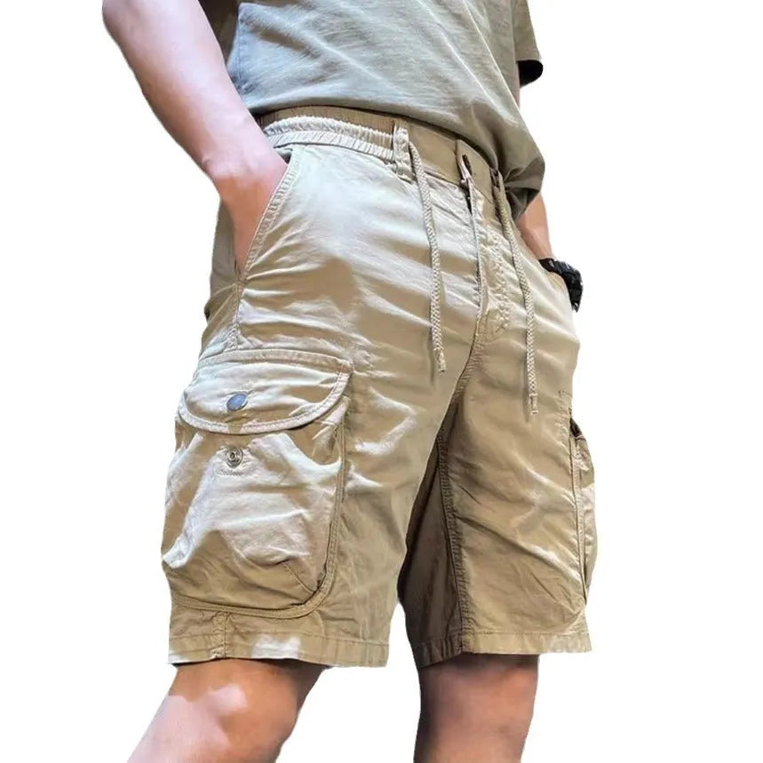 Loose straight multi-pocket casual overalls pants in black, grey, green, or khaki with a relaxed fit and five pockets.