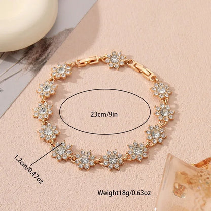 Floral shaped zinc alloy bracelet with electroplated colourful gem finishes in gold and silver tones.