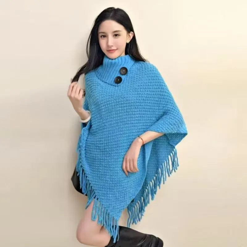 Women's triangle shawl cape in cashmere blend fabric with tassel details, shown draped over shoulders