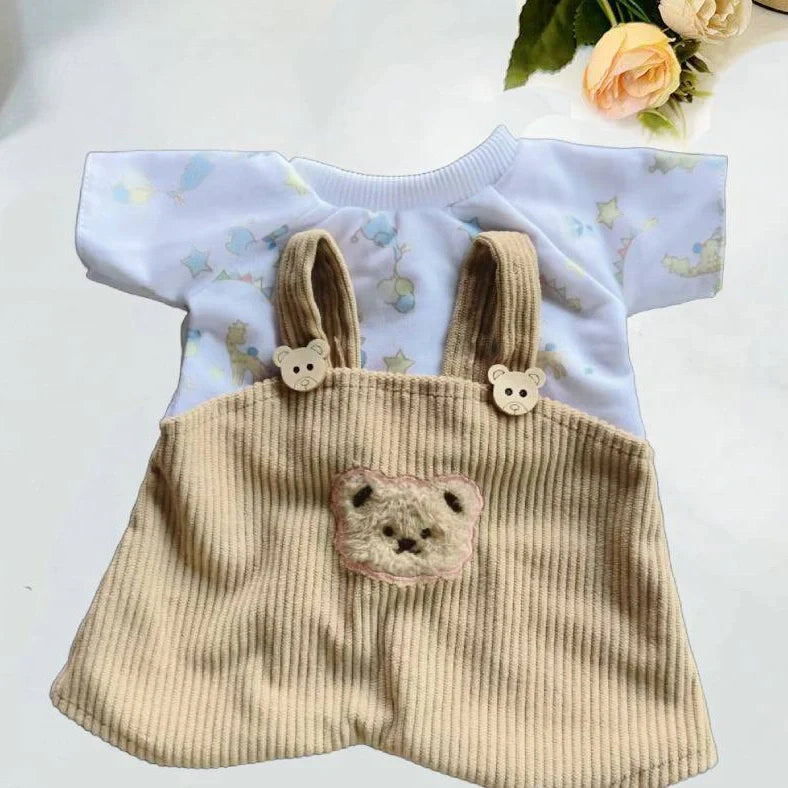 30cm doll clothing collection showing multiple outfit pieces including hooded jackets, sweaters, and suspender pants