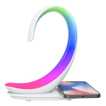 White swan-shaped desktop device with wireless charging surface, Bluetooth speaker, and colourful LED lighting effects