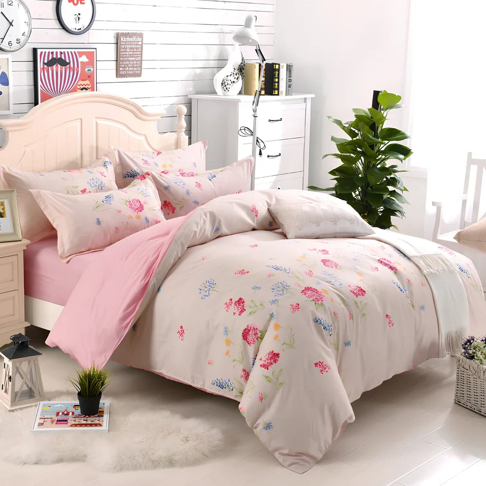 Three-piece cotton bedding set with blue geometric pattern showing duvet cover, fitted sheet, and two pillowcases on a UK double bed