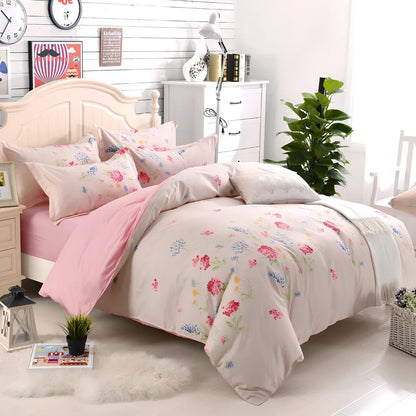 Three-piece cotton bedding set with blue geometric pattern showing duvet cover, fitted sheet, and two pillowcases on a UK double bed