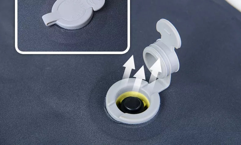 Compact inflatable travel pillow in peacock blue, bright orange, or green for camping and outdoor use