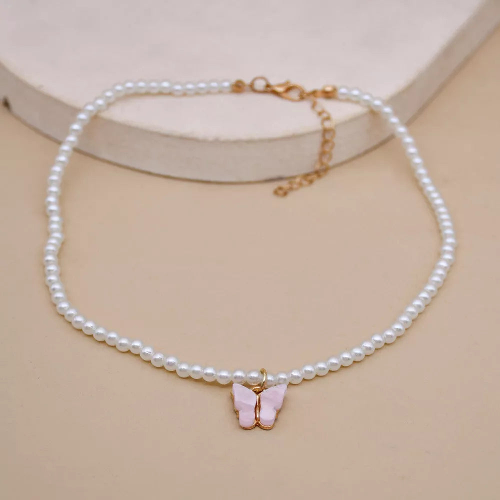 Elegant white pearl choker necklace with butterfly charm for women