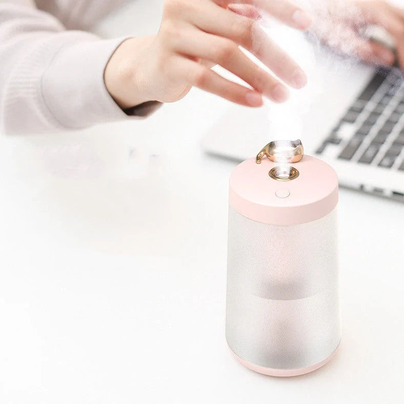 Columnar cat humidifier with electroplated finish and USB cable connection