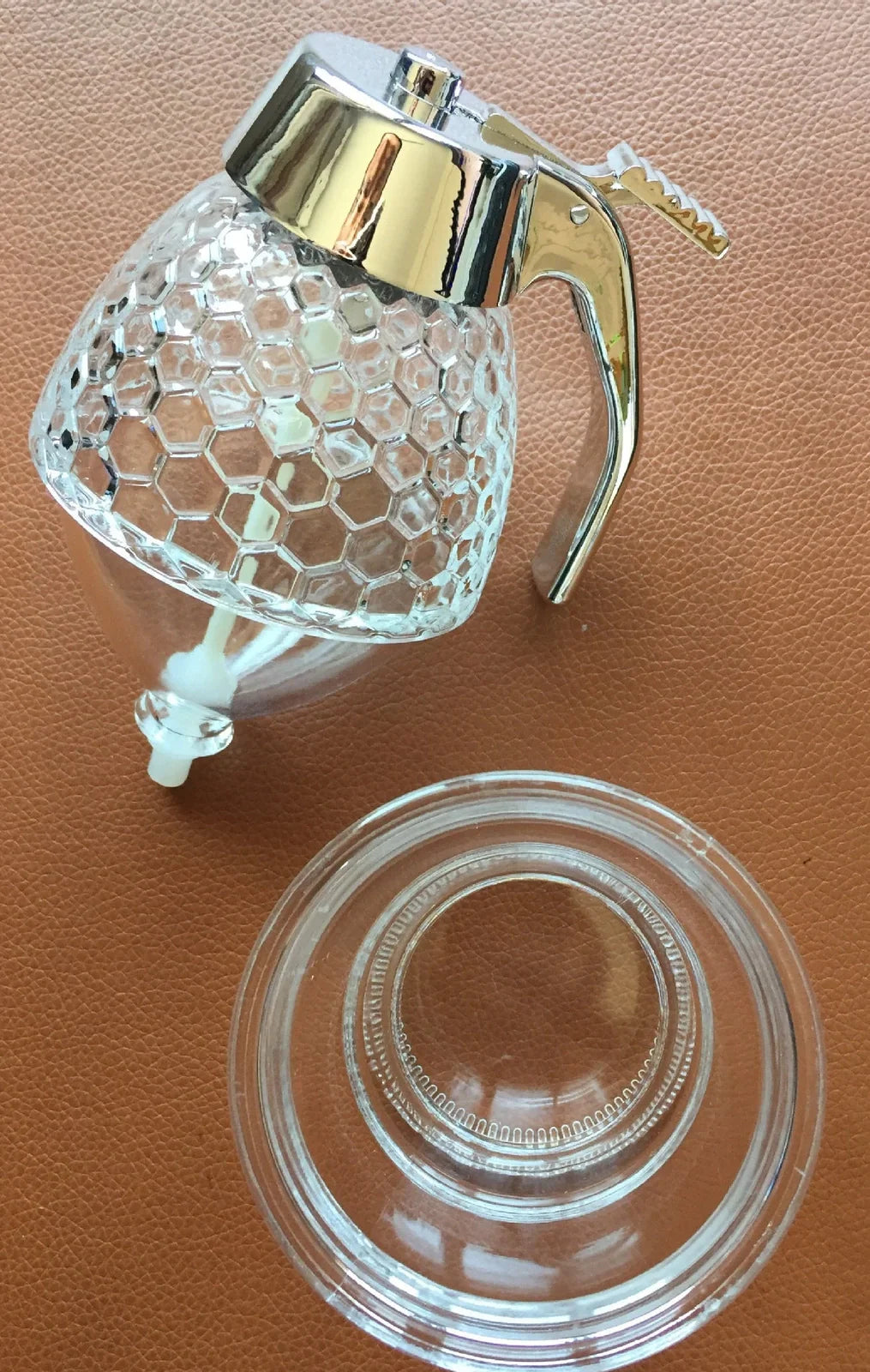 Transparent kitchen honey dispenser showing 200ml capacity with measurements 8.3x10x15cm