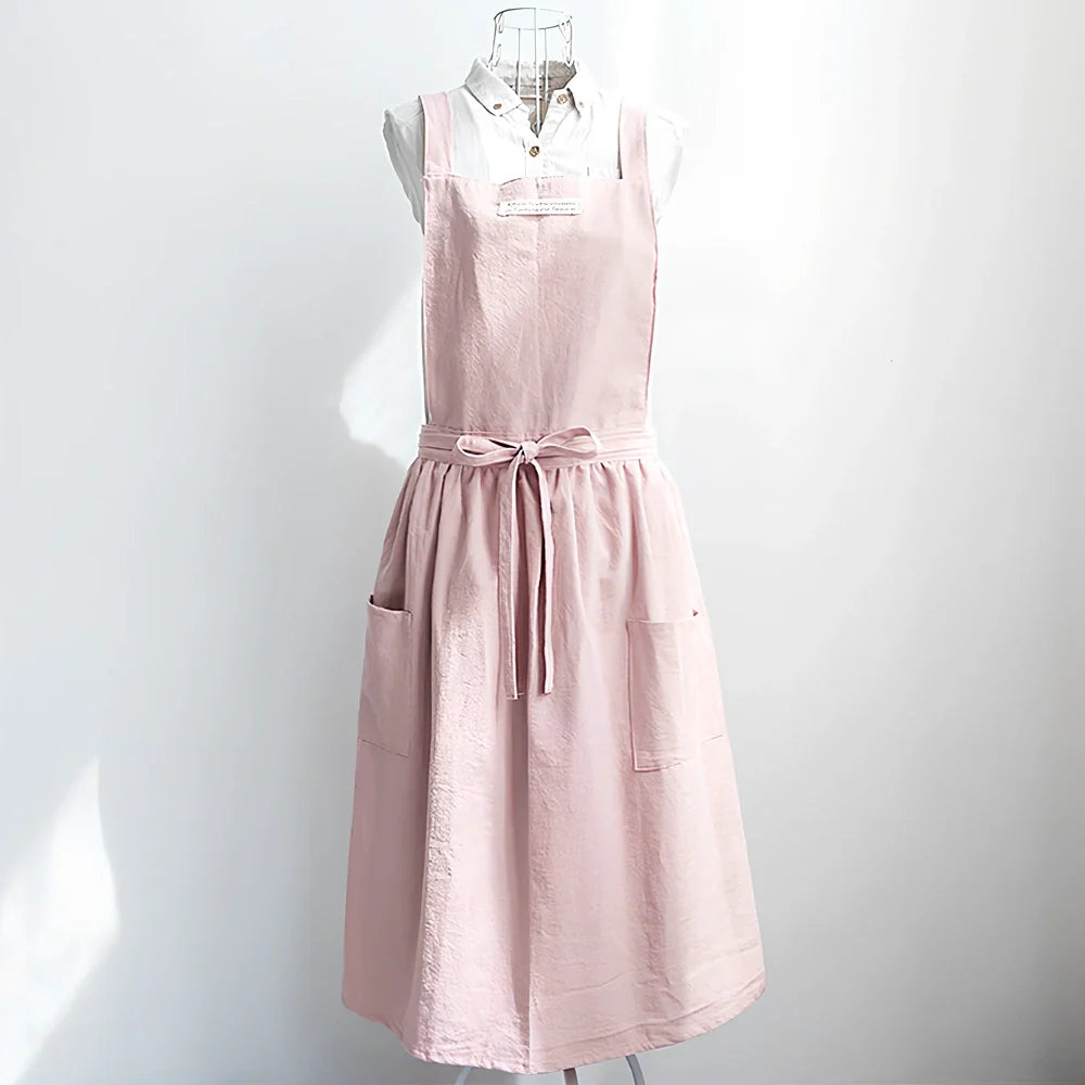 Sleeveless cotton kitchen apron in blue colour showing front coverage and adjustable neck strap