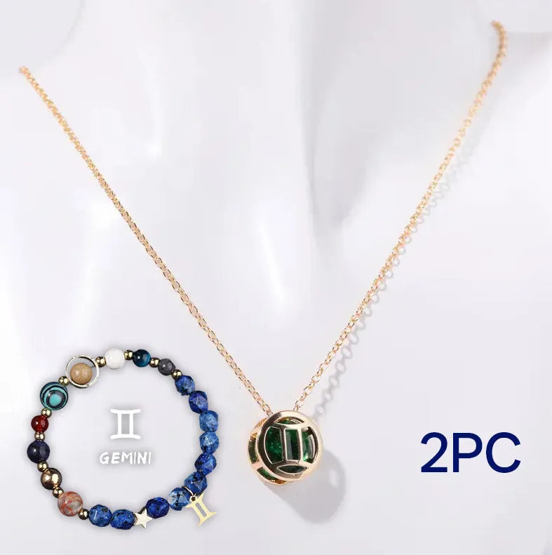 A natural stone beaded necklace and matching adjustable bracelet laid flat.