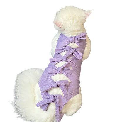 Lace-up cat sterilisation clothing in five colours including pink, purple, blue, brown, and green pineapple, showing adjustable fastening