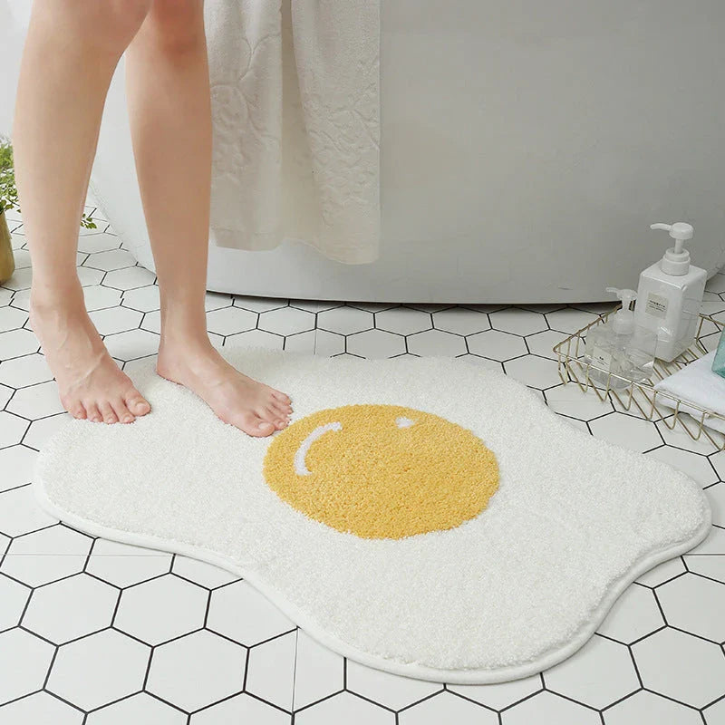 Stylish and functional egg-shaped area rug with a playful design, perfect for adding charm and protecting floors in your home.
