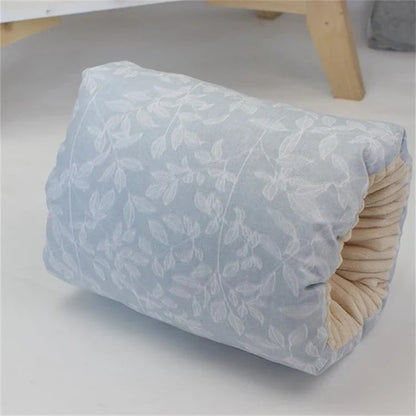 Adjustable cotton nursing pillow with various colorful designs, providing comfort and support for breastfeeding and bottle-feeding