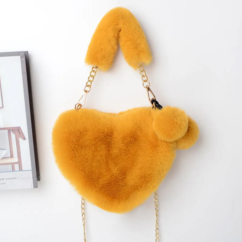 Women's soft plush heart-shaped handbag with shoulder strap in multiple solid colours