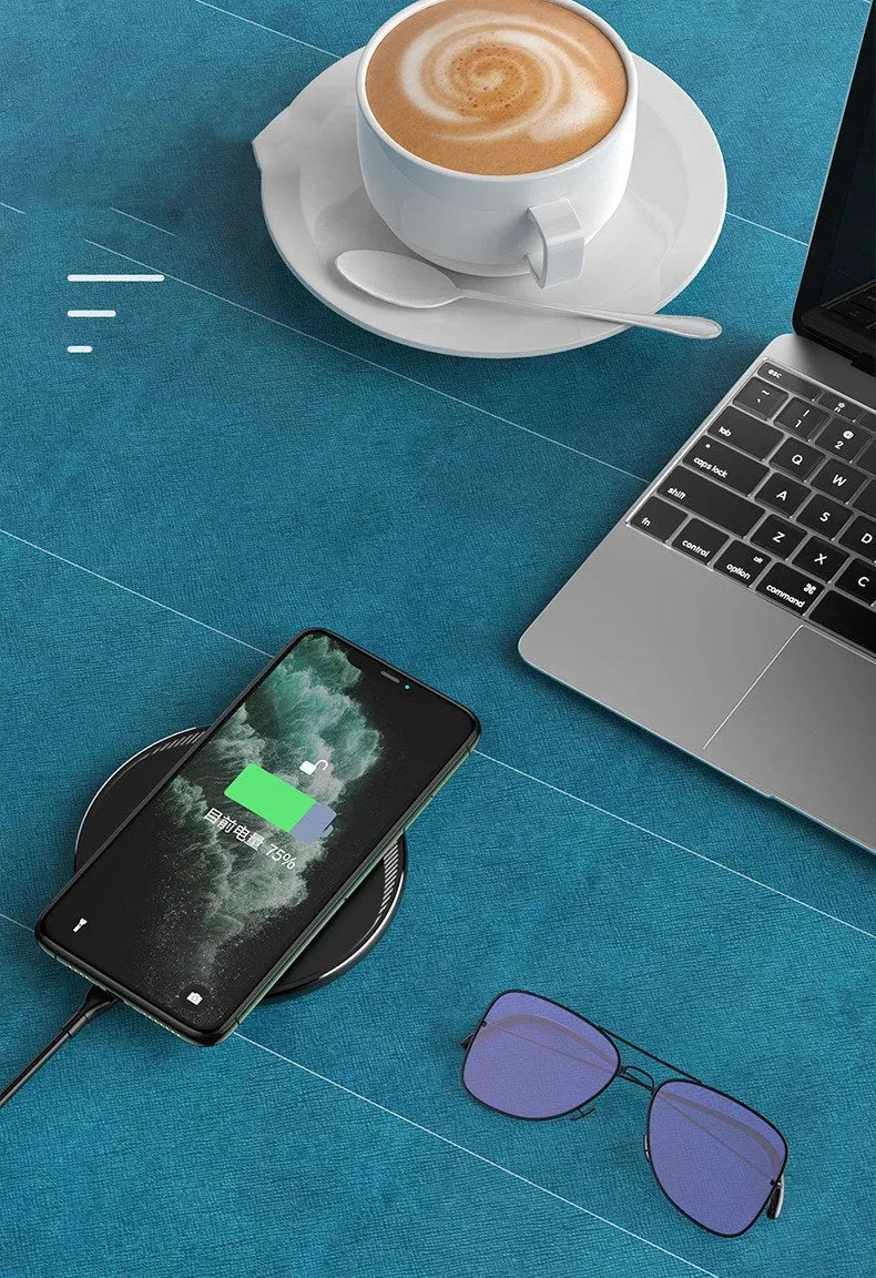 Black Kuulaa KL-CD16 wireless disc charger for mobile phones on a surface.