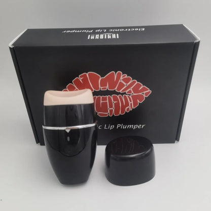 Black and white electric lip plumper device with silicone tip and USB cable