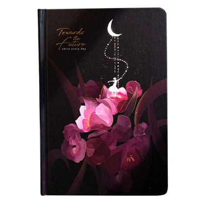 A5 notebook with luminous cover in Deep Blue, open to show 100 gsm paper and colour illustrations