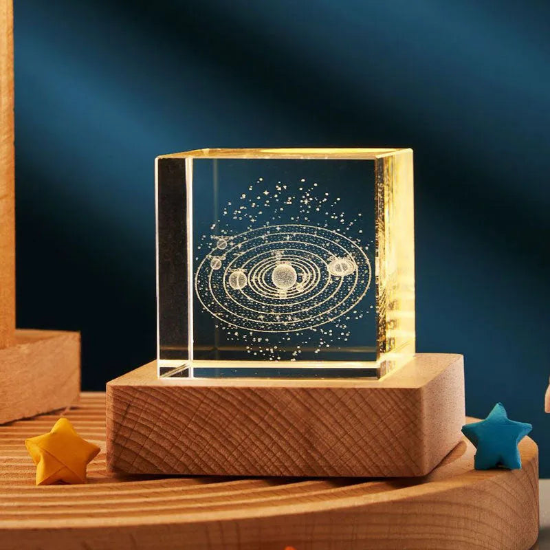 3D crystal cube night lamp showing transparent glass with internal engraving and warm light illumination