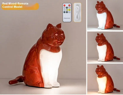 Cat-shaped USB rechargeable table lamp with adjustable colour temperature on wooden desk