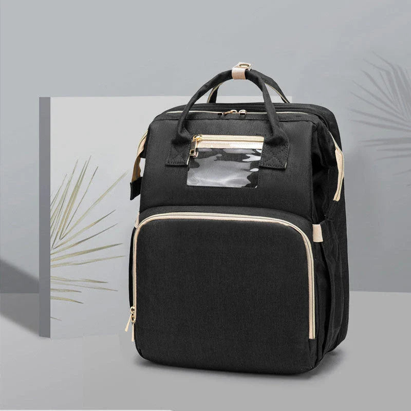 Versatile baby changing backpack with USB charging port and folding portable bed