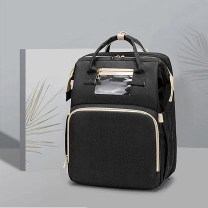 Versatile baby changing backpack with USB charging port and folding portable bed