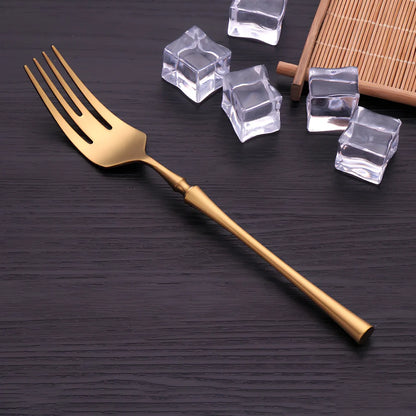 Four-piece stainless steel cutlery set showing main knife, fork, spoon, and teaspoon with mirror finish
