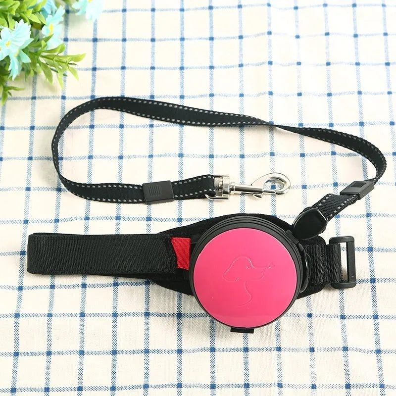 Automatic retractable dog leash extended to 3 metres with a lock button, shown in vibrant orange.