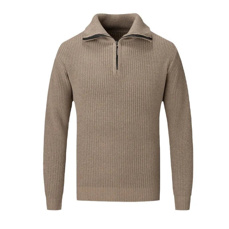 A man wearing a solid-colour slim-fit loose pullover sweater in a neutral colour.