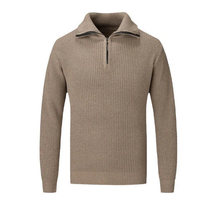 A man wearing a solid-colour slim-fit loose pullover sweater in a neutral colour.