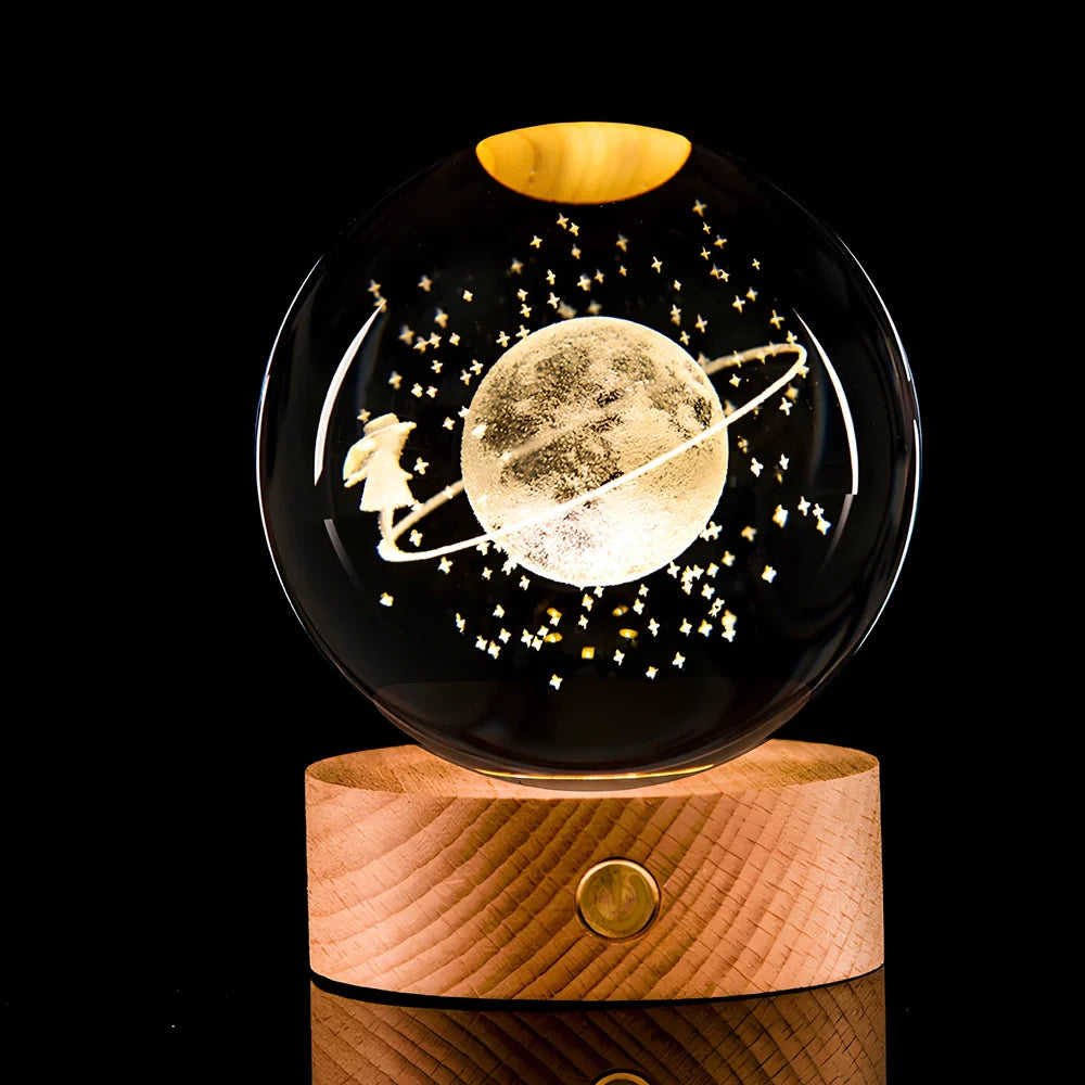 Transparent crystal ball with 3D laser inner carving of galaxy patterns on charging base