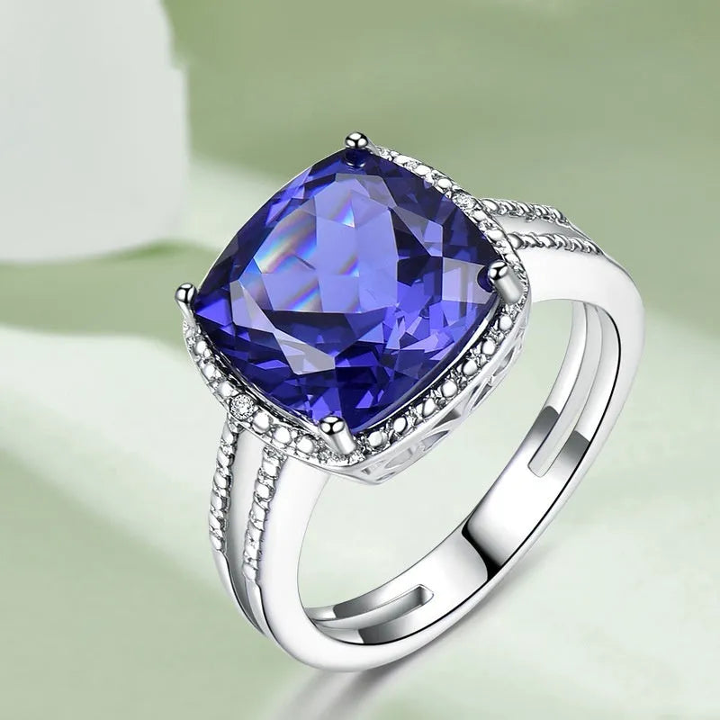 925 sterling silver ring with blue tanzanite gemstone, shown in UK sizes 6 to 10 for women's jewellery