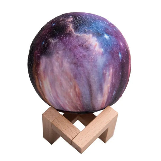 3D-printed spherical lunar night light with LED colours and remote control on a dark surface